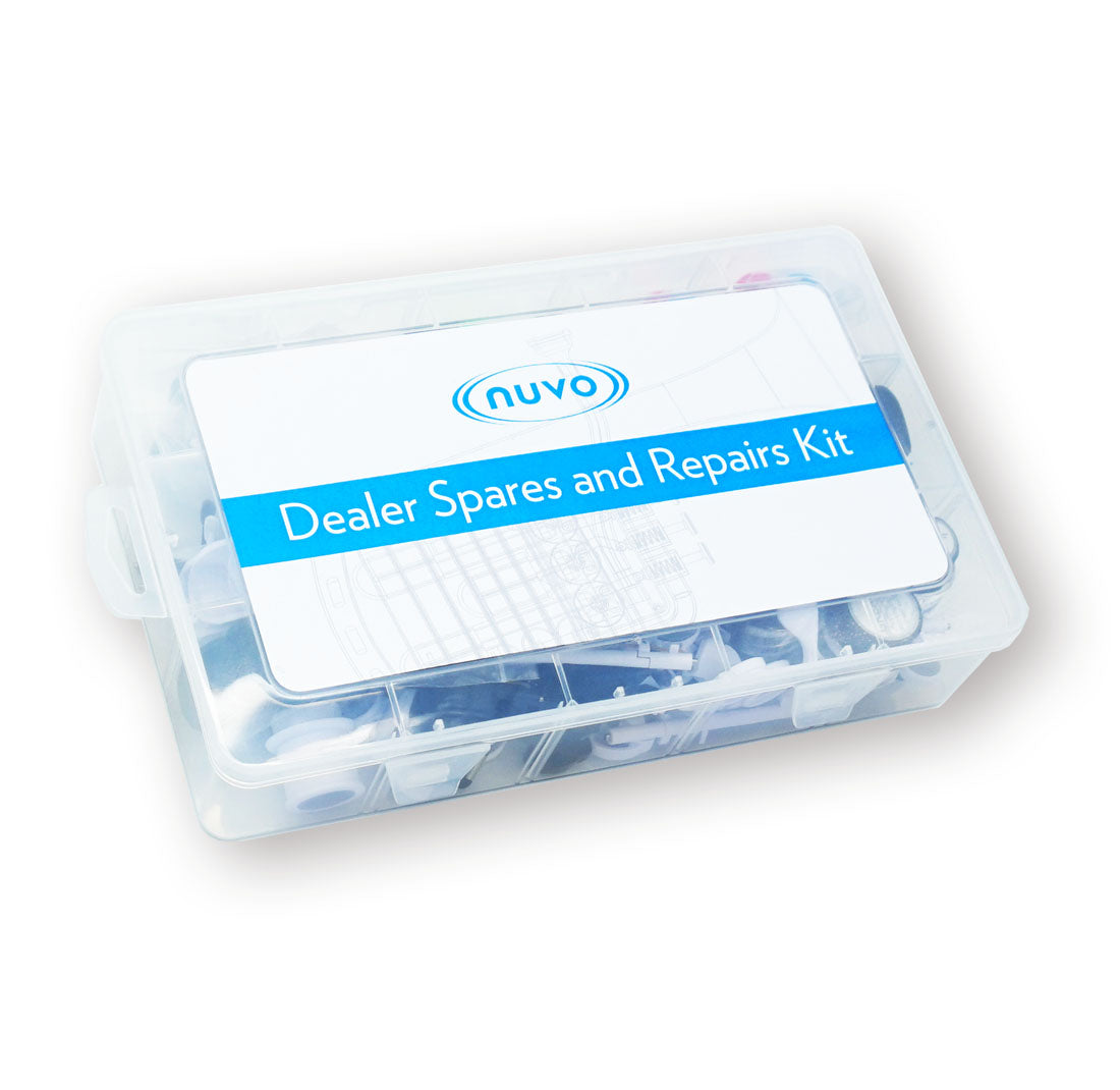 A transparent plastic box labeled "NUVO Dealer Spares & Repairs Kit | Full-Line Service Parts Collection," containing assorted NUVO replacement parts. The white label with blue stripe features the Nuvo logo for easy identification.