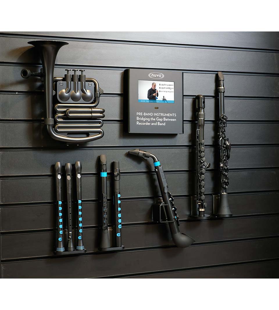 A NUVO Slatwall Fixture – Dood & Toot | Retail Wall Display showcases black and blue plastic wind instruments—recorders, clarinets, saxophone, and French horn—with a pre-band instruments sign for professional merchandising.